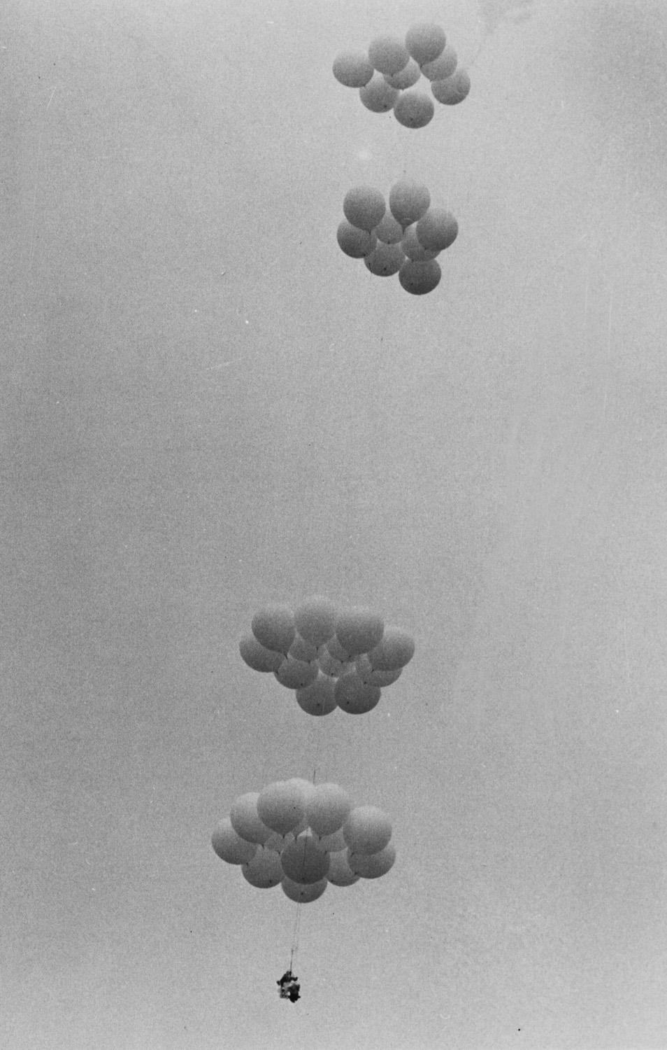 Larry Walters is barely visible as his helium balloon-rigged lawnchair drifts skyward on Friday, July 2, 1982. (AP Photo/Randy Mudrick/San Pedro News Pilot)